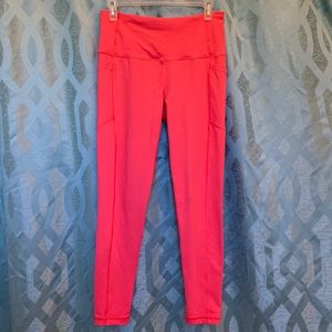 Victoria Sport size medium, 2 side pockets, nice coral color, stretch,